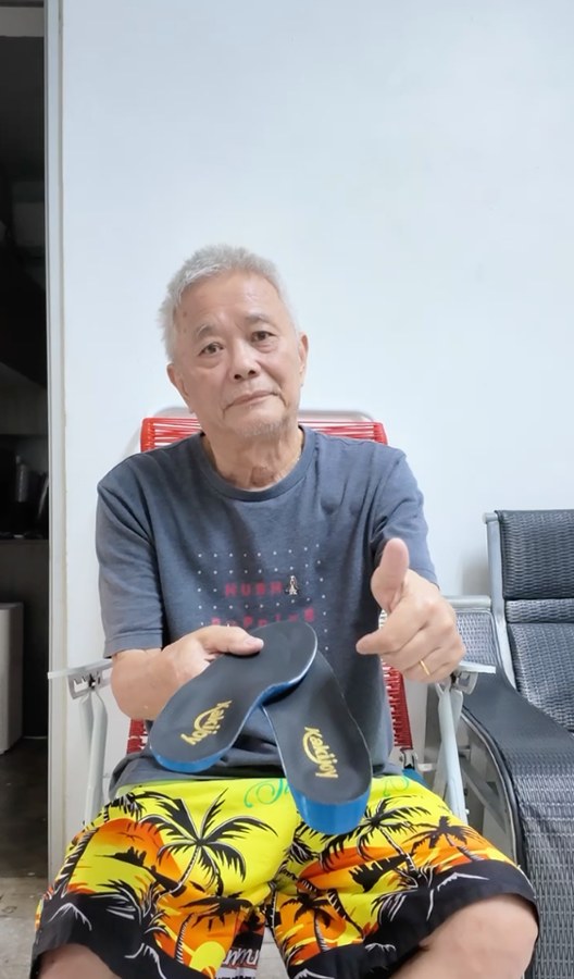 Uncle Hew holding one of his custom KakiJoy insoles
